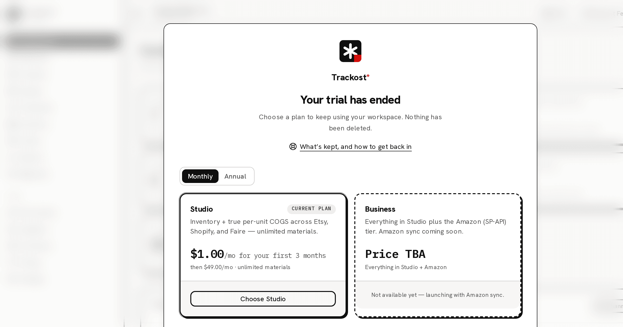 The Dashboard behind the plan wall: the page is blurred, and the wall in front says Your trial has ended, with the link to this article, the Monthly and Annual choice and the Studio and Business plan cards